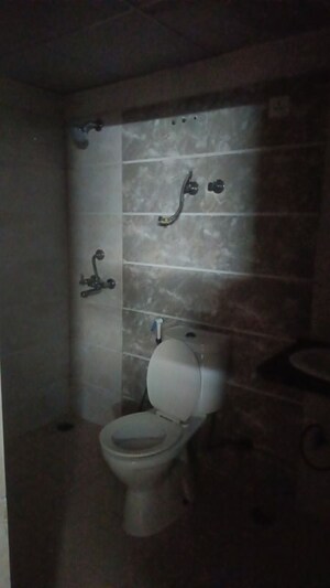 Bathroom in 3 BHK Apartment at Aims Golf City, Sector 75 – for Rent