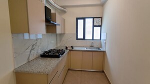 Kitchen in 3 BHK Apartment at Suncity Vatsal Valley, Gwal Pahari – for Rent