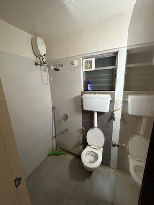 Bathroom in 2 BHK Apartment at Unique Poonam Estate Cluster 3, Mira Road – for Rent