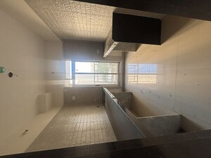 Kitchen in 1 BHK Apartment at Vihang Vermont, Ghodbunder Road – for Sale