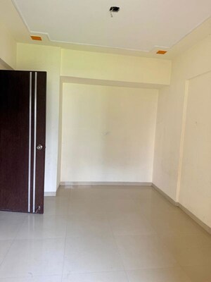 Room in 2 BHK Apartment at Umiya Uma Paradise Complex, Titwala – for Sale