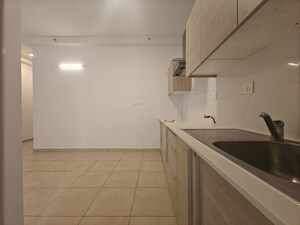 Kitchen in 1.5 BHK Apartment at Bhartiya City Nikoo Homes II, Thanisandra Main Road – for Sale