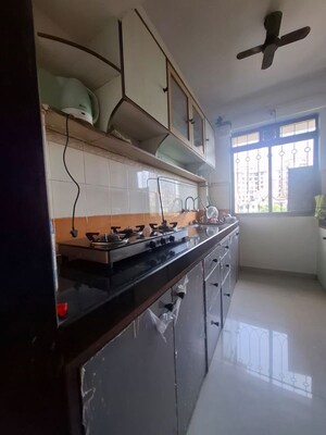Kitchen in 2 BHK Apartment at Lodha Paradise, Majiwada – for Rent