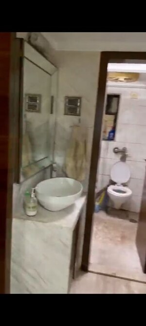 Bathroom in 4 BHK Apartment at Accord CHS Andheri West, Andheri West – for Rent