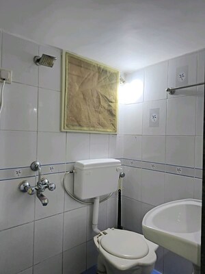Bathroom in 3 BHK Apartment at Shiv Sagar Apartments, Tilak Nagar – for Rent