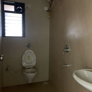 Bathroom in 3 BHK Apartment at Greenfield Om Satyam Niwas CHS, Dalvi Nagar – for Rent