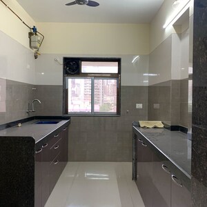 Kitchen in 3 BHK Apartment at Greenfield Om Satyam Niwas CHS, Dalvi Nagar – for Rent