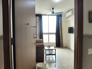 Living Room in 1 BHK Apartment at Hiranandani The Walk, Ghodbunder Road – for Rent