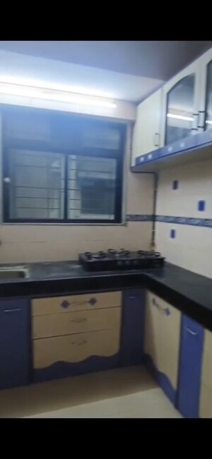Kitchen in 2 BHK Apartment at Divya Smruthi, Malad West – for Rent