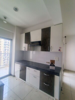 Kitchen in 2 BHK Apartment at Gulshan Bellina, Sector 16 Greater Noida – for Rent
