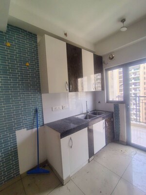 Kitchen in 2 BHK Apartment at Gulshan Bellina, Sector 16 Greater Noida – for Rent