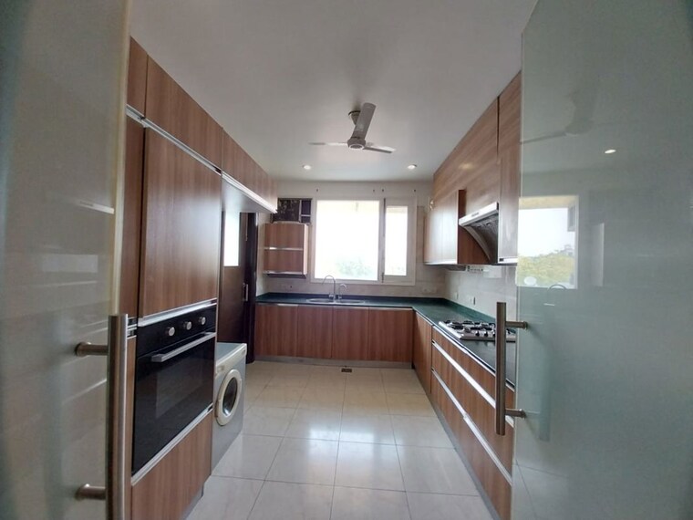 Kitchen, gulmohar park 4 Bedroom 425 Sq.Yd. Builder Floor In Gulmohar Park Delhi 10389549