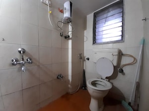 Bathroom in 3 BHK Apartment at Doordarshan CHS, Goregaon East – for Rent