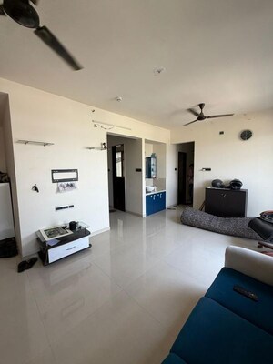 Living Room in 2.5 BHK Apartment at Pharande Puneville, Punawale – for Rent