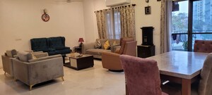 Living Room in 4 BHK Apartment at Tata Raheja Raisina Residency, Sector 59 – for Sale