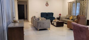 Living Room in 4 BHK Apartment at Tata Raheja Raisina Residency, Sector 59 – for Sale
