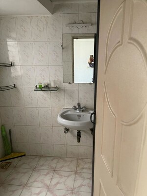 Bathroom in 2 BHK Apartment at Serenity Tower, Andheri West – for Rent