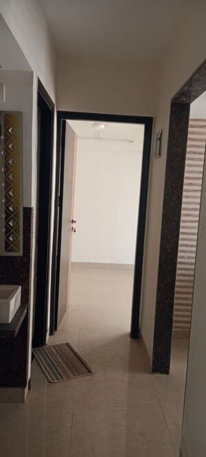Building Lobby in 1 BHK Apartment at Tharwani Vedant Millenia, Titwala – for Rent
