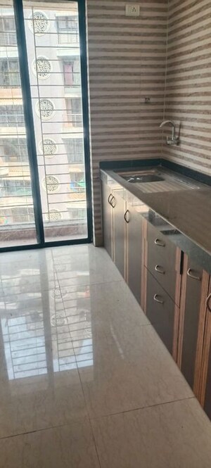 Kitchen in 1 BHK Apartment at Tharwani Vedant Millenia, Titwala – for Rent