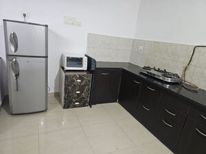Kitchen in 2 BHK Apartment at Brahma Suncity, Wadgaon Sheri – for Rent