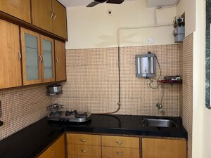Kitchen in 1 BHK Apartment at Yashraaj Park CHS LTD, Ghodbunder Road – for Rent
