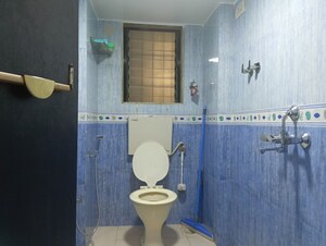 Bathroom in 2 BHK Apartment at Abrol Krishna Balaji, Malad West – for Rent