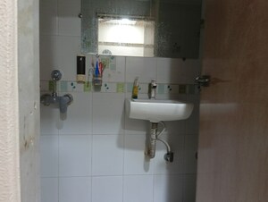 Bathroom in 2 BHK Apartment at Abrol Krishna Balaji, Malad West – for Rent