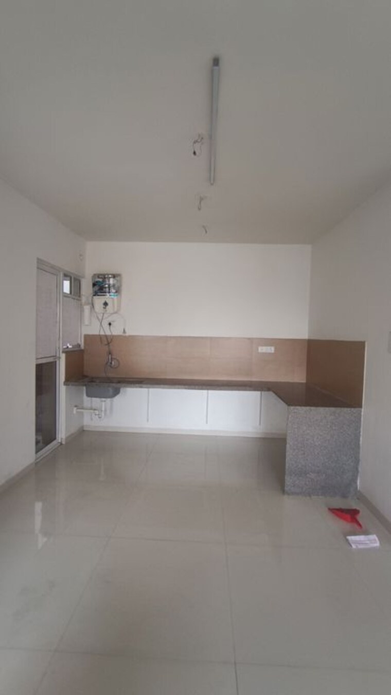 Kitchen, rohan-ananta 2 Bedroom 850 Sq.Ft. Apartment In Tathawade Pune 10390798