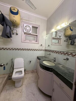 Bathroom in 4 BHK Builder Floor at Pamposh Enclave – for Rent
