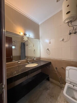 Bathroom in 4 BHK Builder Floor at Pamposh Enclave – for Rent