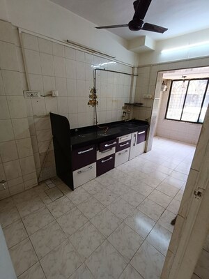 Kitchen in 1 BHK Apartment at Mangal Orchid Chs, Andheri West – for Rent