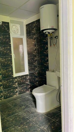 Bathroom in 2 BHK Apartment at Migsun Roof, Raj Nagar Extension – for Sale