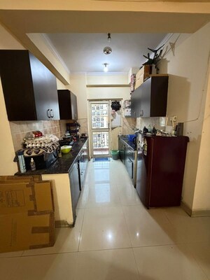Kitchen in 2.5 BHK Apartment at Aims Golf City, Sector 75 – for Rent
