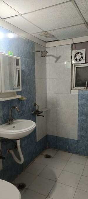 Bathroom in 2 BHK Apartment at Aims Golf City, Sector 75 – for Rent