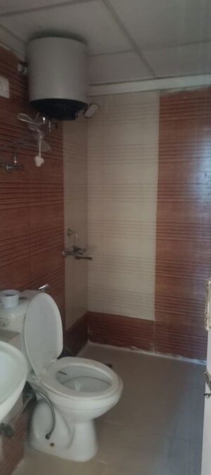 Bathroom in 2 BHK Apartment at Aims Golf City, Sector 75 – for Rent