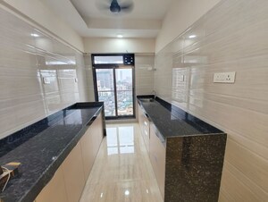 Kitchen in 3 BHK Apartment at Je And Vee Om Trimurti, Malad East – for Sale