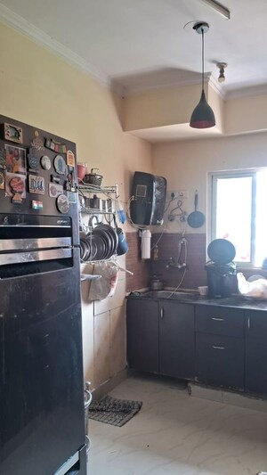 Kitchen in 3 BHK Apartment at Amrapali Silicon City, Sector 76 – for Rent