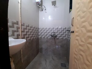 Bathroom in 1 BHK Apartment at Unnat Nagar CHS, Goregaon West – for Rent