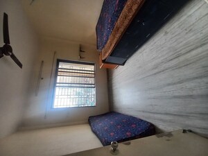 Bedroom in Studio Apartment at Vanrai Shopping Premises, Goregaon East – for Rent