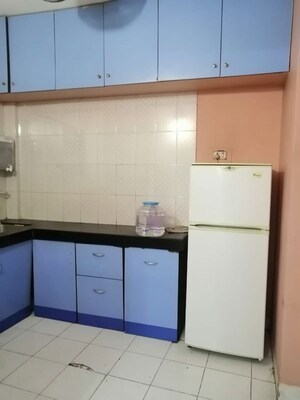 Kitchen in 3 BHK Apartment at Riddhi Enclave Co-op Housing Society Ltd, Viman Nagar – for Rent