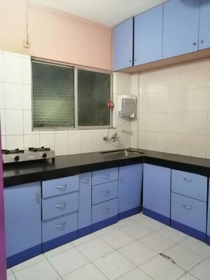 Kitchen in 3 BHK Apartment at Riddhi Enclave Co-op Housing Society Ltd, Viman Nagar – for Rent