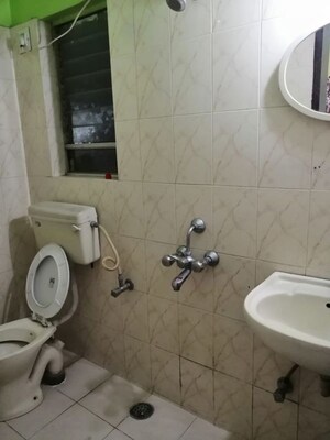 Bathroom in 3 BHK Apartment at Riddhi Enclave Co-op Housing Society Ltd, Viman Nagar – for Rent