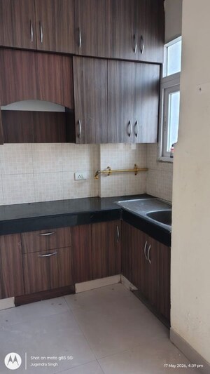 Kitchen in 2 BHK Apartment at Aims Golf City, Sector 75 – for Rent