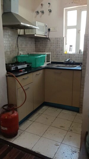 Kitchen in 1 BHK Apartment at Arun Vihar, Sector 29 – for Rent