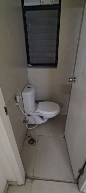 Bathroom in 1 BHK Apartment at Runwal Gardens, Dombivli East – for Rent
