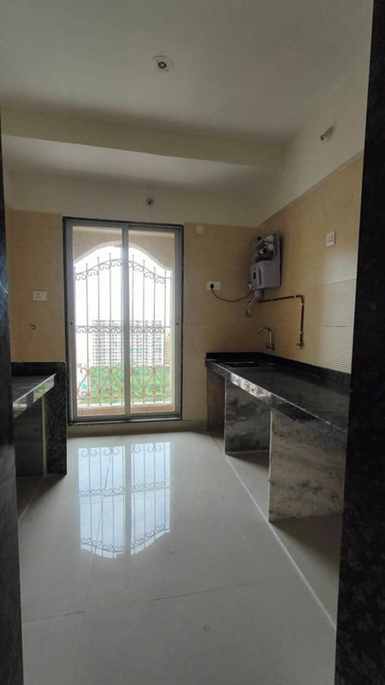 Kitchen, lok-amber 1 Bedroom 675 Sq.Ft. Apartment In Ambernath Thane 10393083