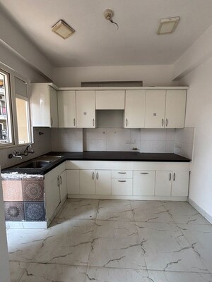 Kitchen in 3 BHK Apartment at Casa Woodstock, Sector 16c Greater Noida – for Sale