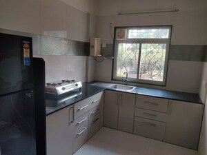 Kitchen in 2 BHK Apartment at Shri Suvarna Apartment, Kothrud – for Rent
