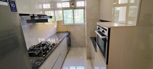 Kitchen in 2 BHK Apartment at Hiranandani Skylark Enclave, Ghodbunder Road – for Sale