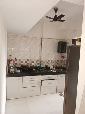 Kitchen in 1 BHK Apartment at Cosmos Orchid, Ghodbunder Road – for Rent